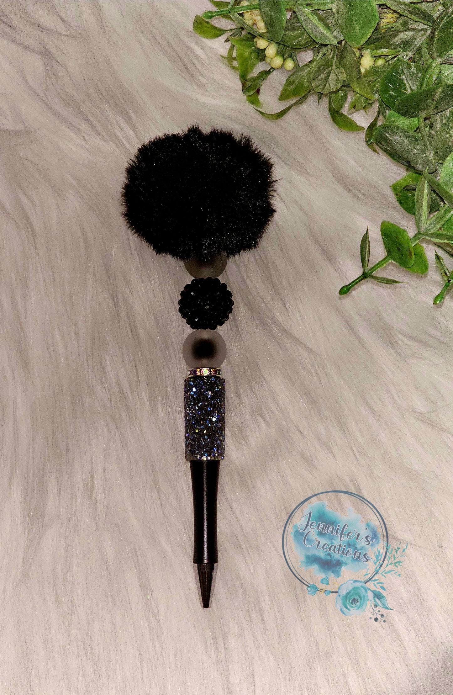 Black pom pom pen